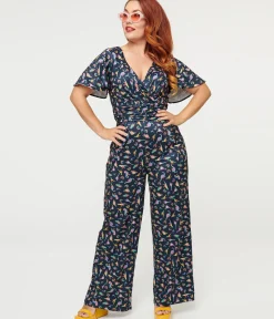Unique Vintage Pocket Dresses>Dolly & Dotty Black Dinosaur & Rainbow Print Charlotte Jumpsuit