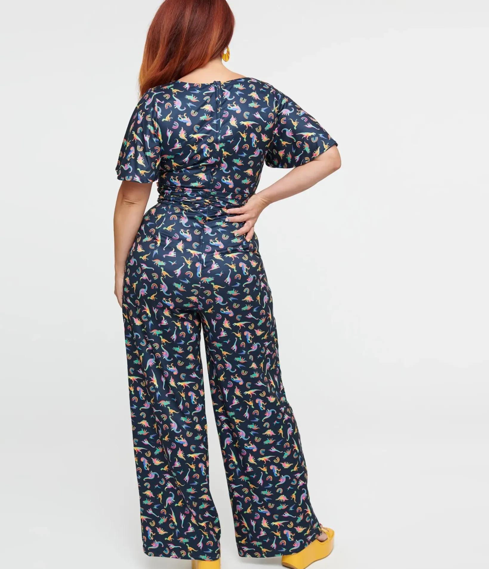Unique Vintage Pocket Dresses>Dolly & Dotty Black Dinosaur & Rainbow Print Charlotte Jumpsuit