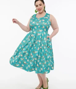 Unique Vintage Swing|Pocket Dresses>Dolly & Dotty 1950s Turquoise Meerkat Print Amanda Swing Dress